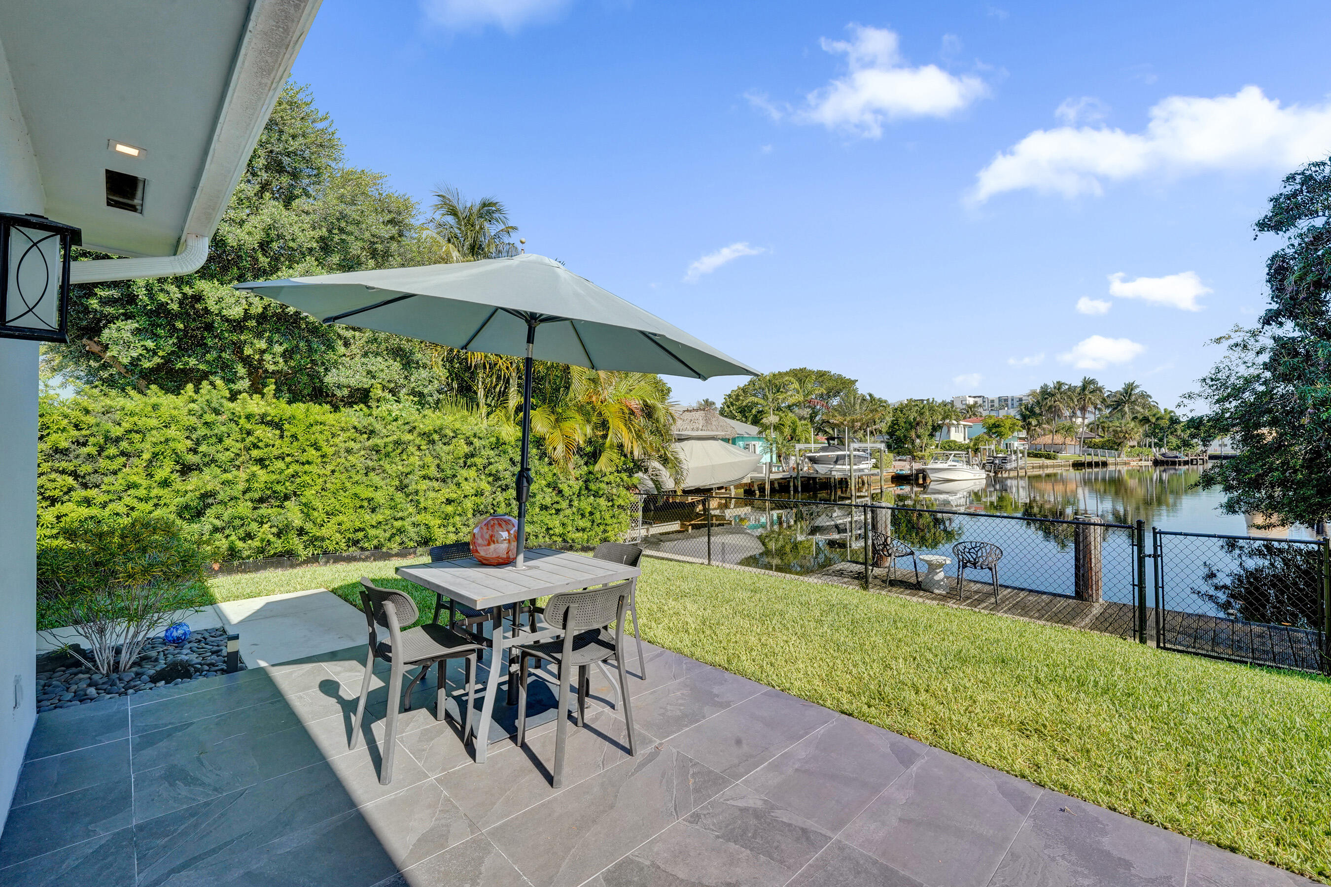 381 Southeast 3rd Street Pompano Beach, FL 33060 - Photo 15 of 41 a view of a backyard with furniture and a garden