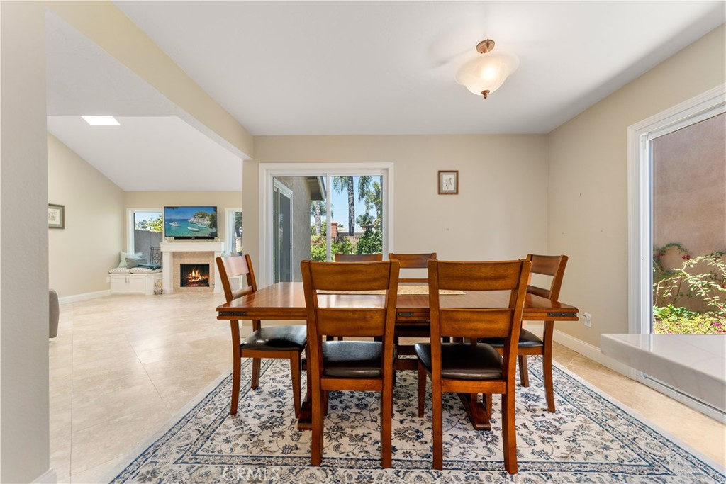 1106 Ridgecrest Circle Costa Mesa, CA 92627 - Photo 13 of 31 a dining room with furniture and window
