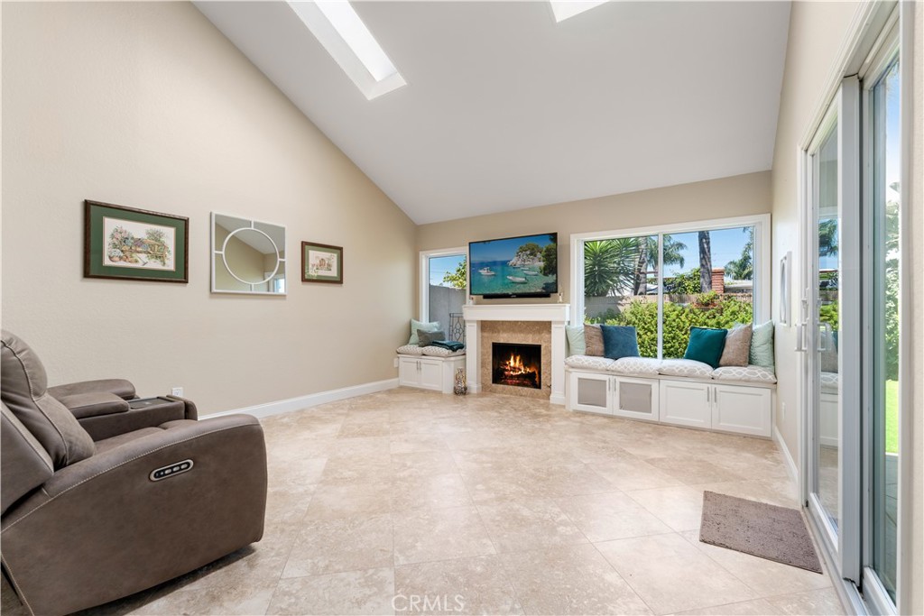 1106 Ridgecrest Circle Costa Mesa, CA 92627 - Photo 14 of 31 a living room with furniture and a fireplace