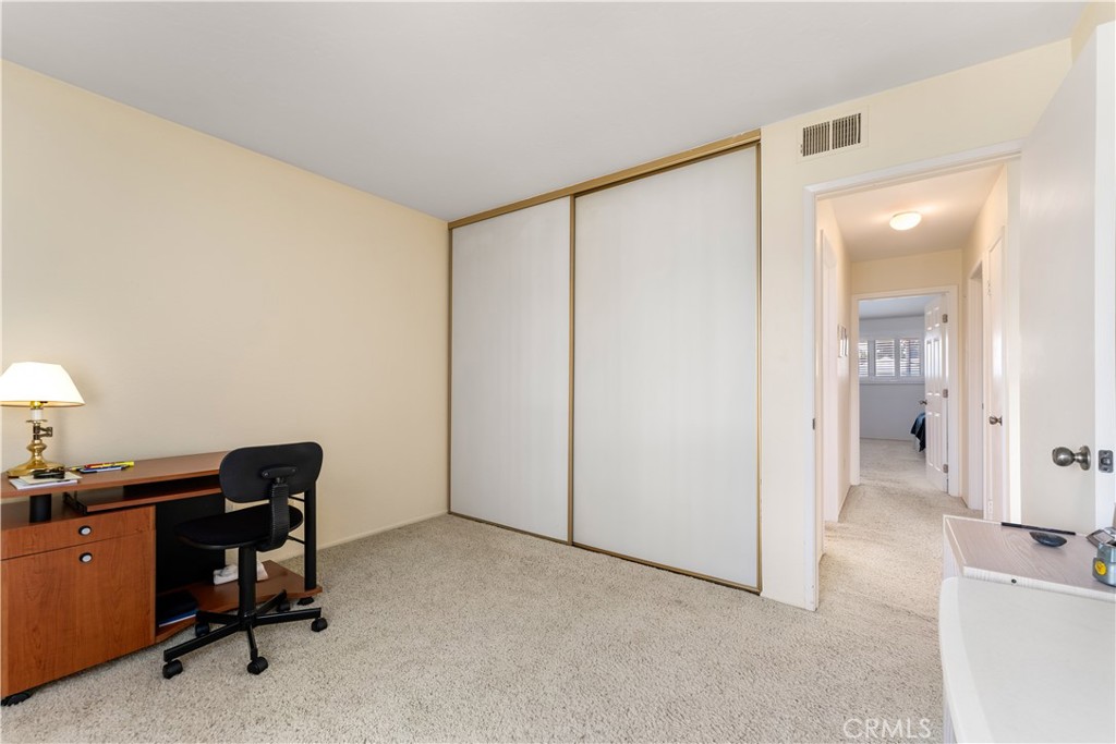 1106 Ridgecrest Circle Costa Mesa, CA 92627 - Photo 20 of 31 a view of a workspace with furniture and a lamp