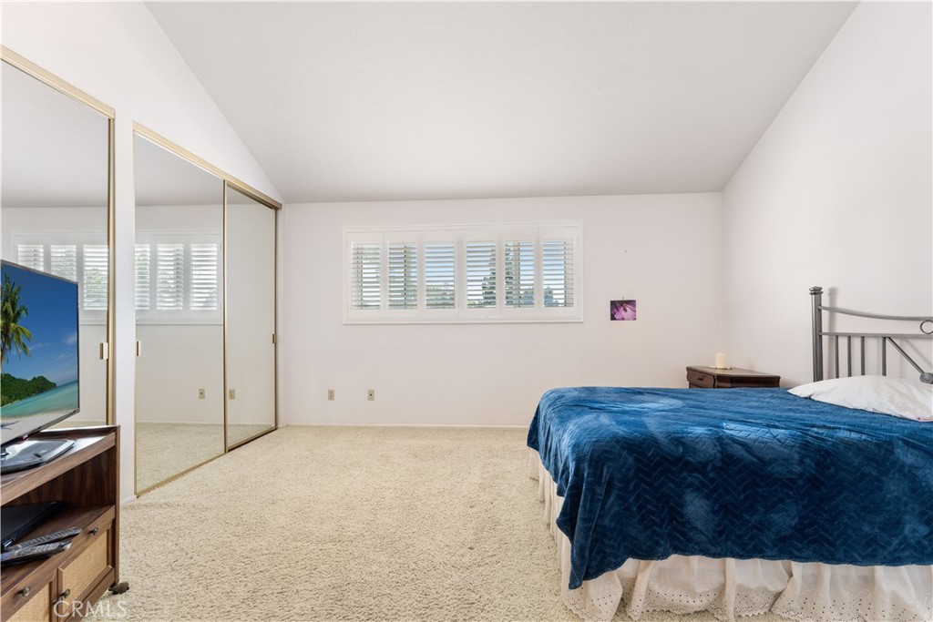 1106 Ridgecrest Circle Costa Mesa, CA 92627 - Photo 25 of 31 a bedroom with a bed and a flat screen tv