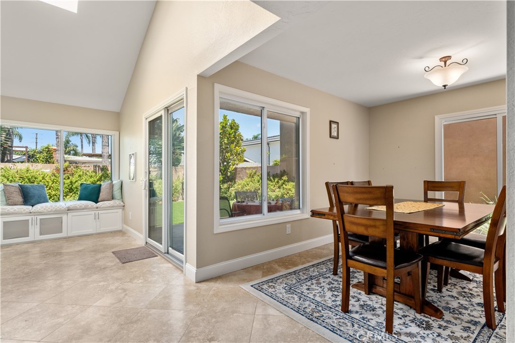 1106 Ridgecrest Circle Costa Mesa, CA 92627 - Photo 6 of 31 a view of a dining room with furniture and a window