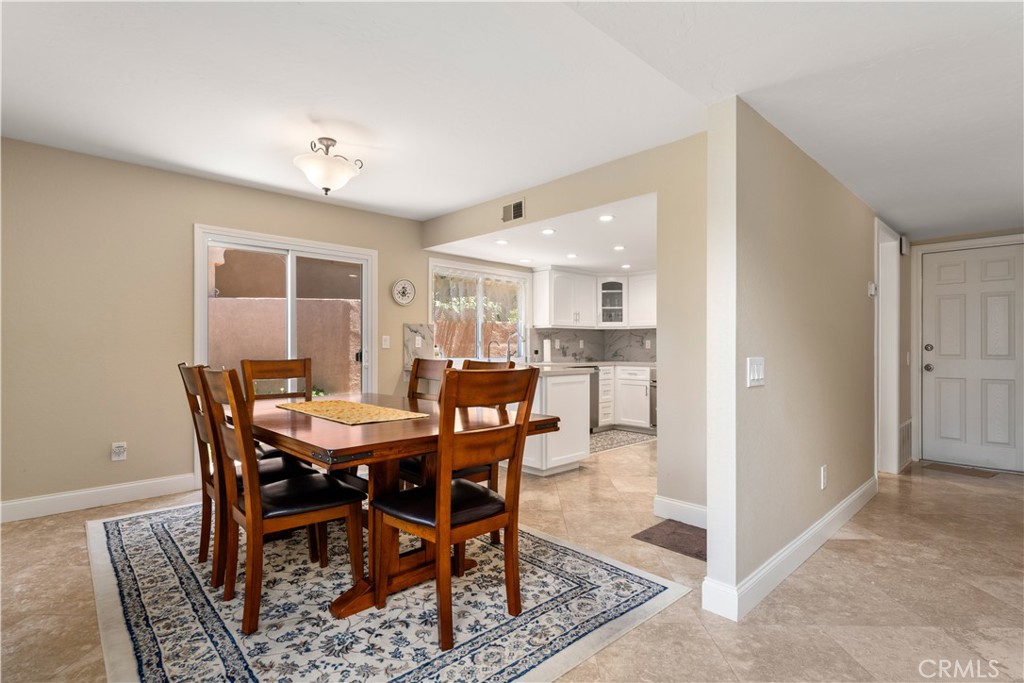 1106 Ridgecrest Circle Costa Mesa, CA 92627 - Photo 7 of 31 a view of a dining room with furniture
