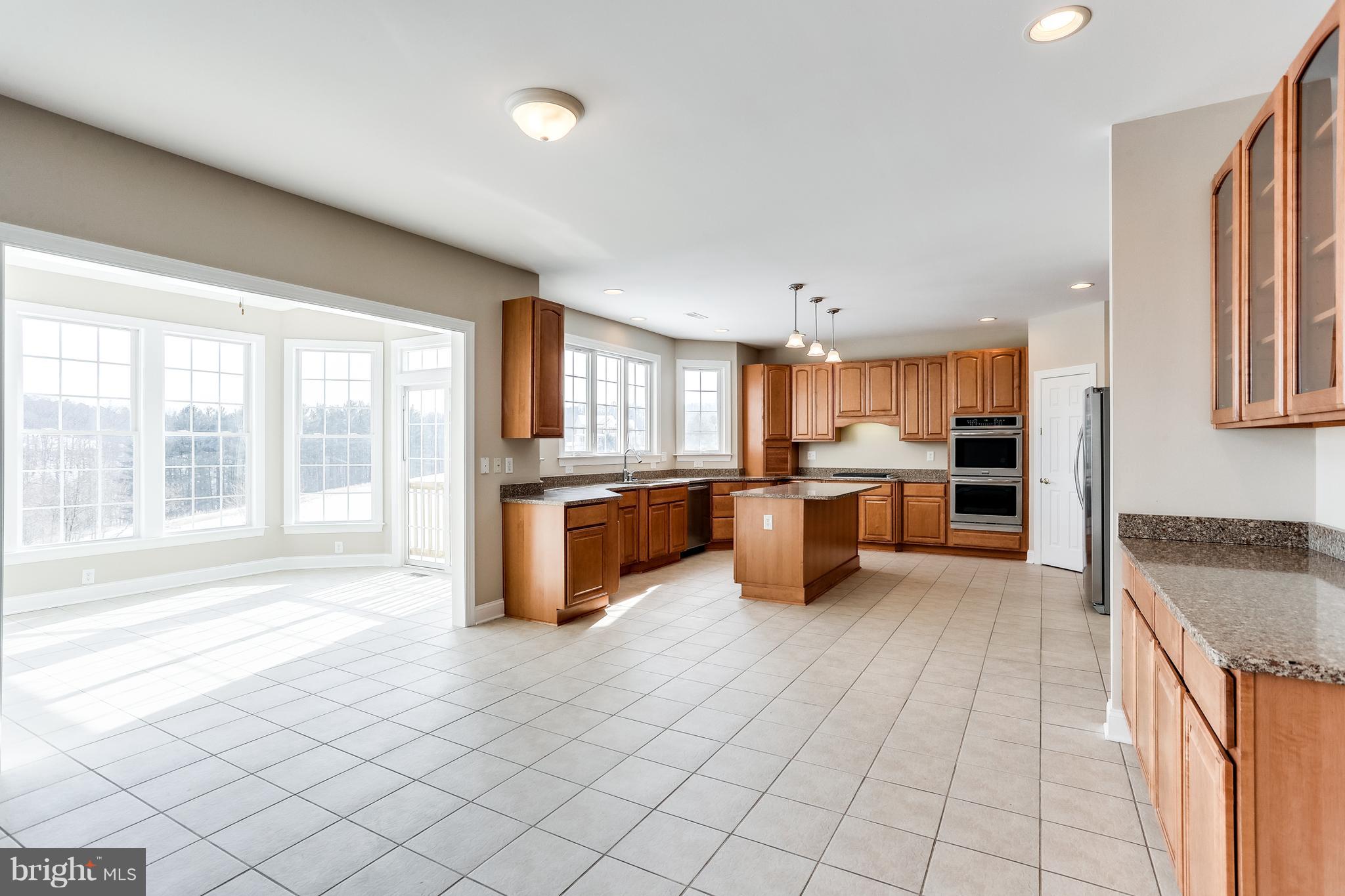 3109 Timber Ridge Circle White Hall, MD 21161 - Photo 16 of 49 Sunroom and kitchen view with ceramic flooring