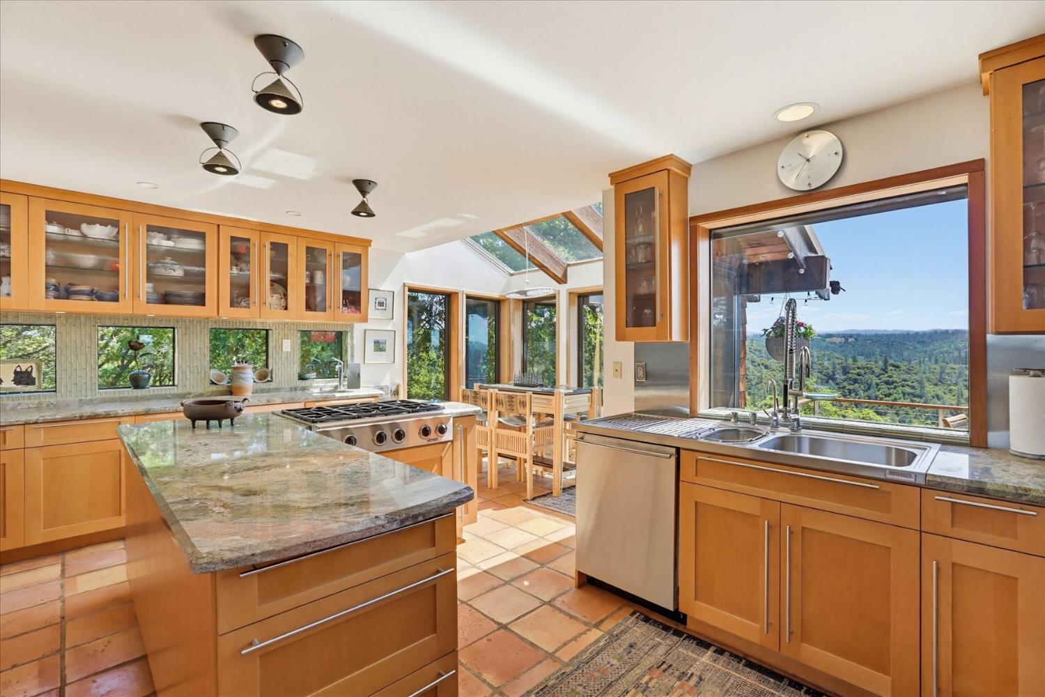 20111 Tanglewood Road Grass Valley, CA 95945 - Photo 17 of 93 a kitchen with stainless steel appliances granite countertop a stove and a large window
