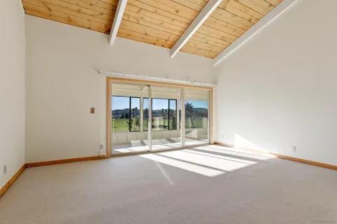 a large kitchen with kitchen island granite countertop a large window