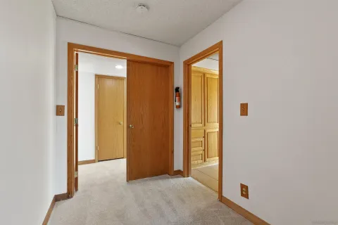 a view of a big room with wooden walls