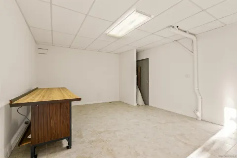 a front view of a building with a yard