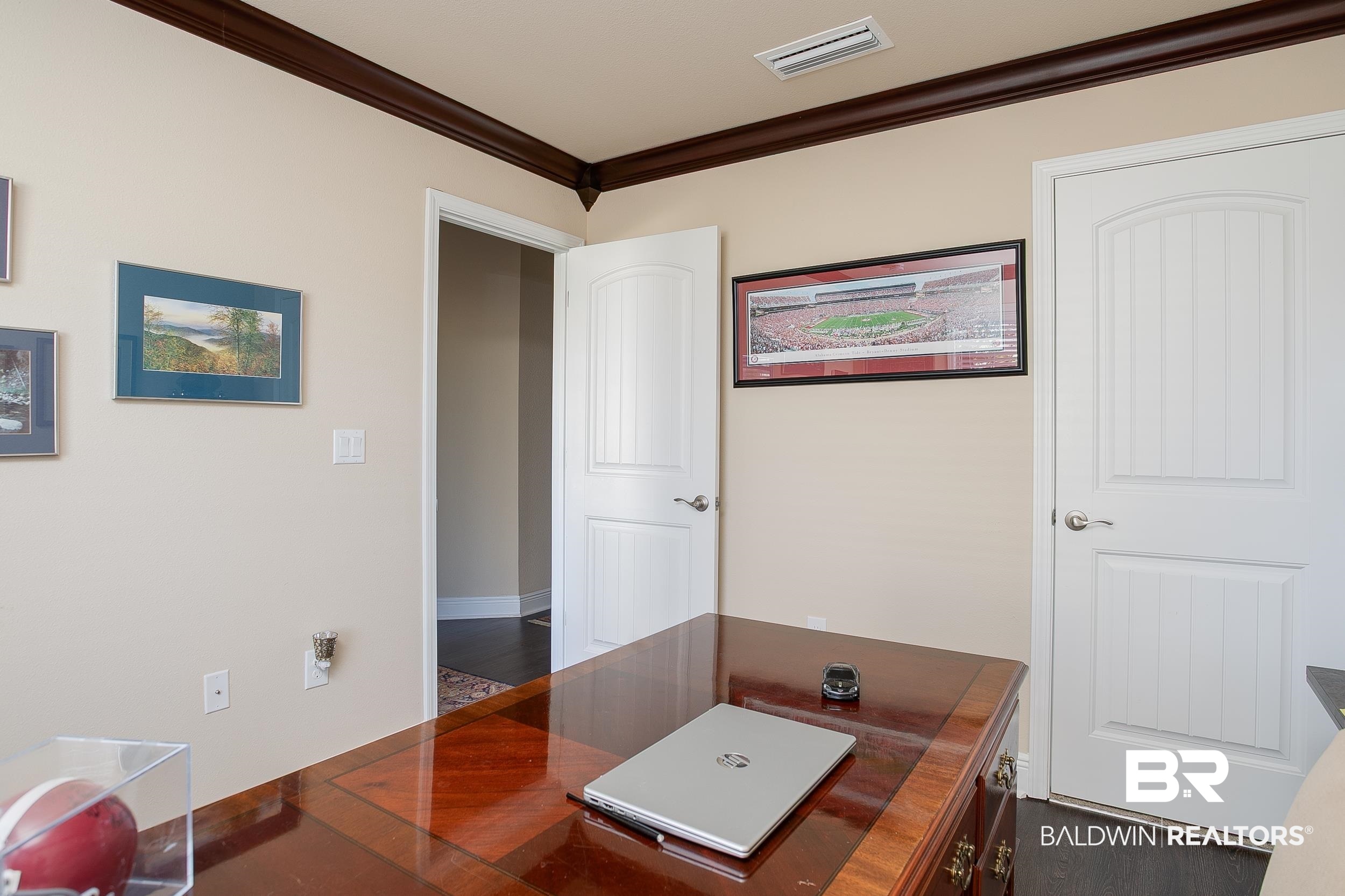 13154 Vincent Court Foley, AL 36535 - Photo 21 of 41 Home office with dark wood finished floors, crown molding, and visible vents
