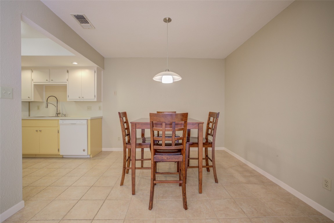 306 Corral Lane, Unit B Austin, TX 78745 - Photo 11 of 33 a dining room with furniture and window