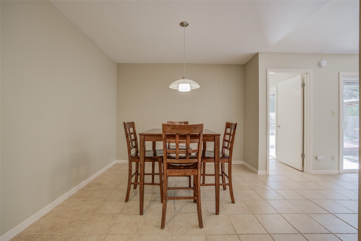 306 Corral Lane, Unit B Austin, TX 78745 - Photo 13 of 33 a dining room with furniture and window