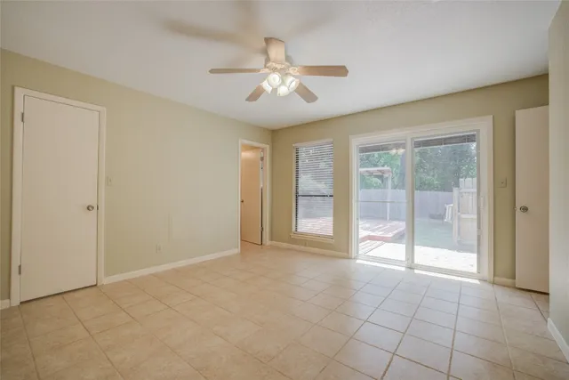 a view of an empty room with glass door