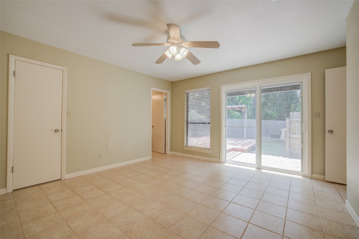 306 Corral Lane, Unit B Austin, TX 78745 - Photo 18 of 33 a view of an empty room with glass door