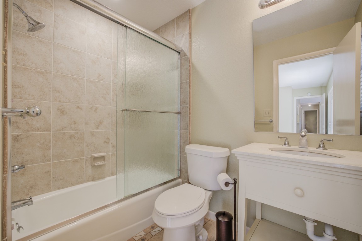 306 Corral Lane, Unit B Austin, TX 78745 - Photo 19 of 33 a bathroom with a sink toilet and shower