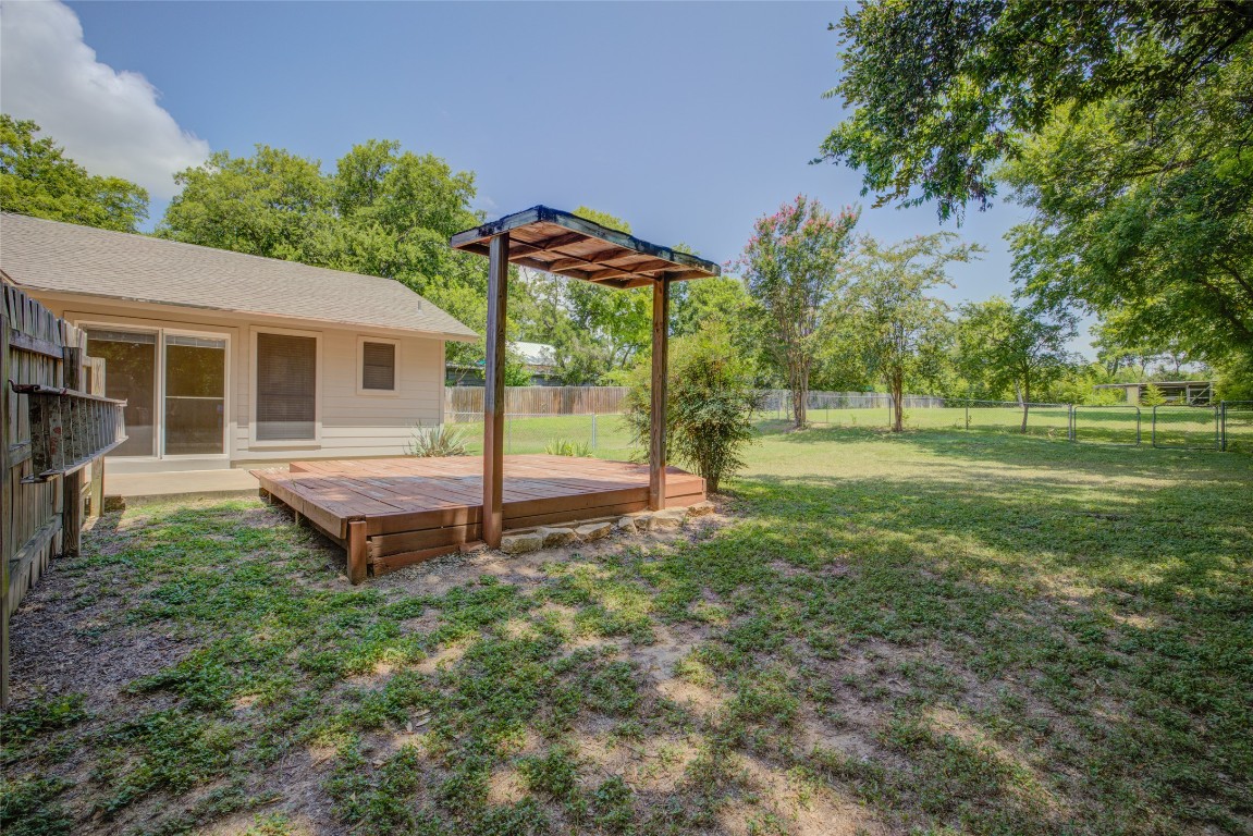 306 Corral Lane, Unit B Austin, TX 78745 - Photo 29 of 33 a view of a house with a backyard and a tree