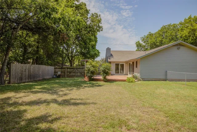 a house with trees in the background