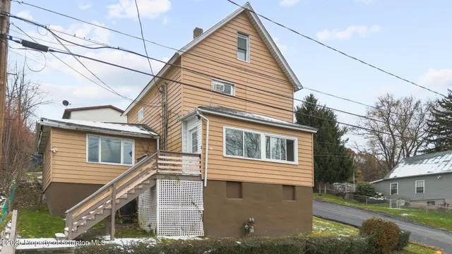 a view of a house with a street