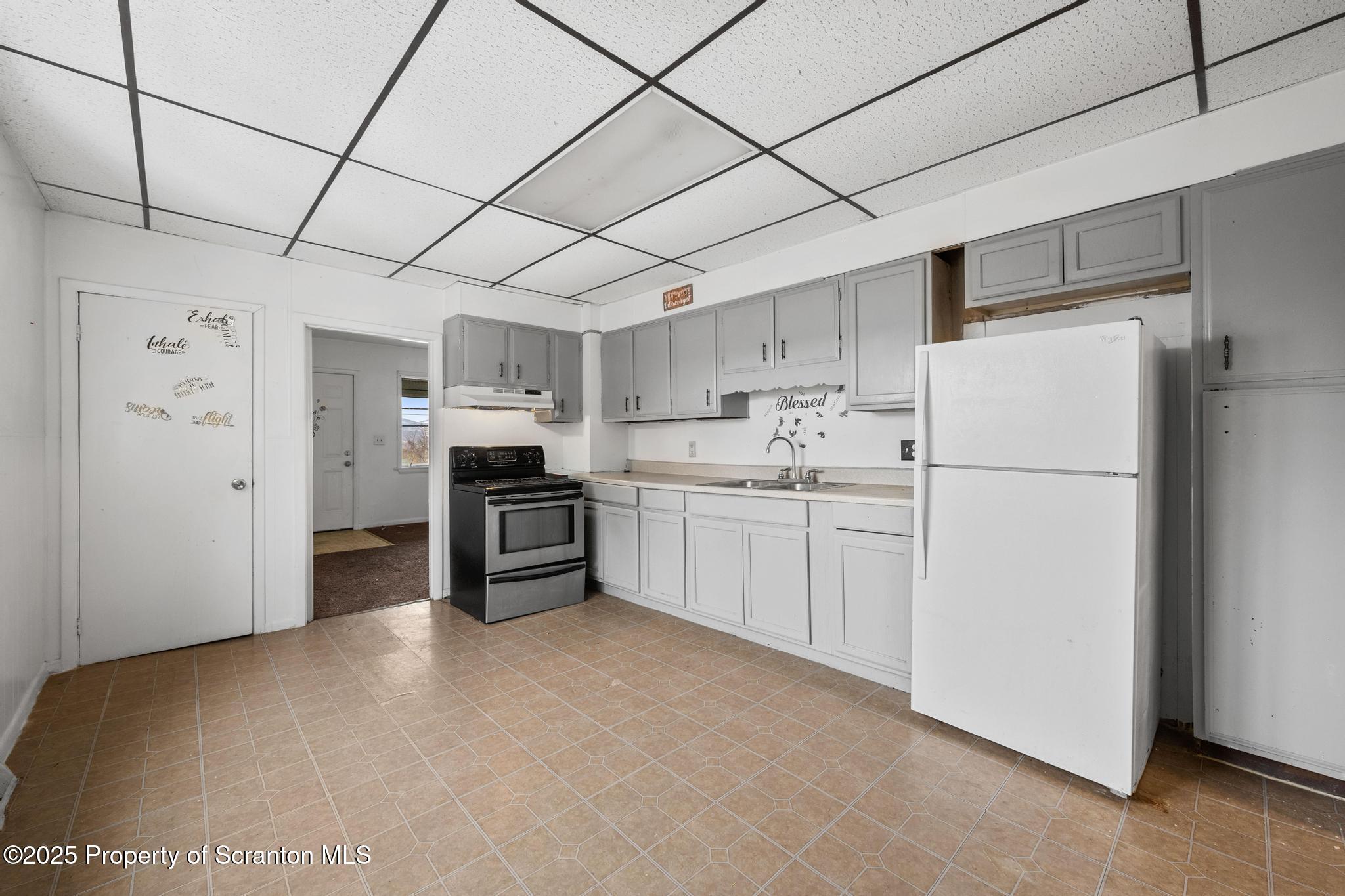 729 Moltke Avenue Scranton, PA 18505 - Photo 23 of 43 a kitchen with stainless steel appliances a refrigerator sink and cabinets