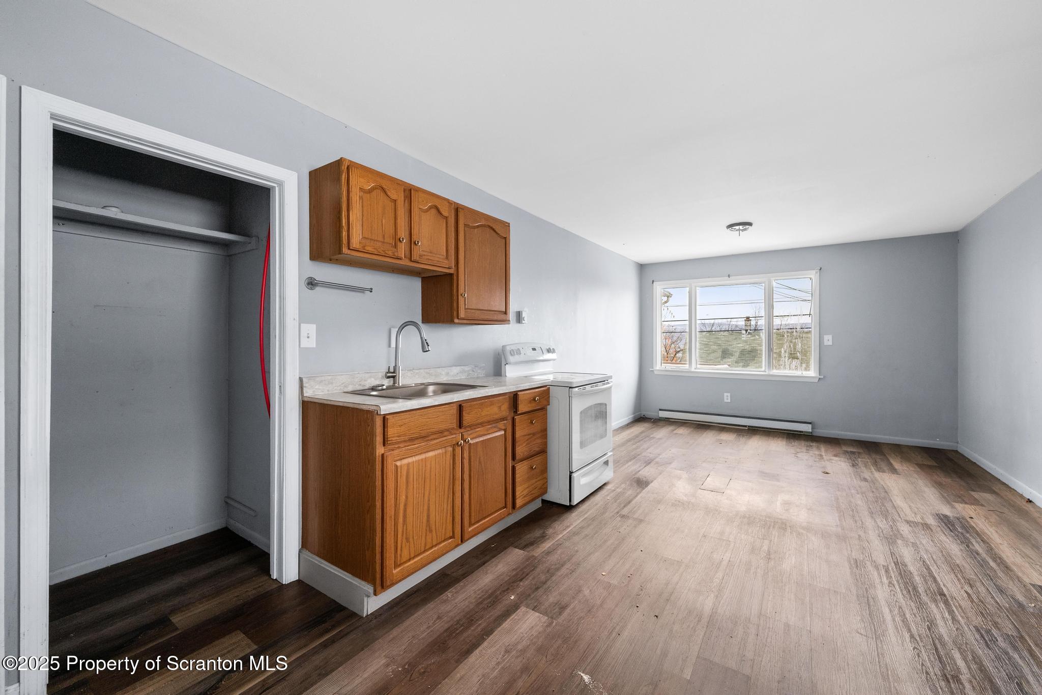 729 Moltke Avenue Scranton, PA 18505 - Photo 26 of 43 a large kitchen with stainless steel appliances granite countertop a stove a sink and a refrigerator