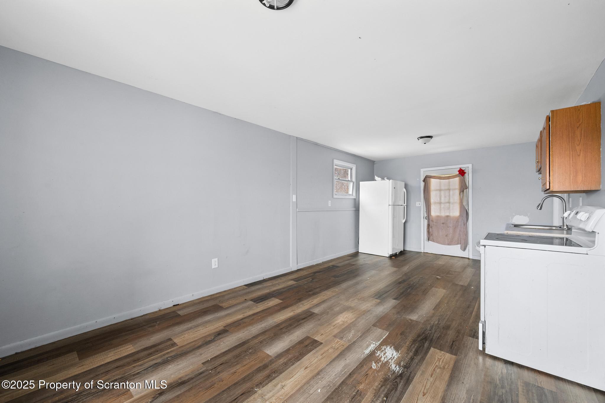 729 Moltke Avenue Scranton, PA 18505 - Photo 27 of 43 a view of a kitchen with sink and dishwasher with wooden floor