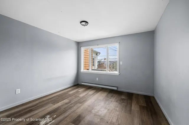 a bathroom with a toilet a sink and a mirror