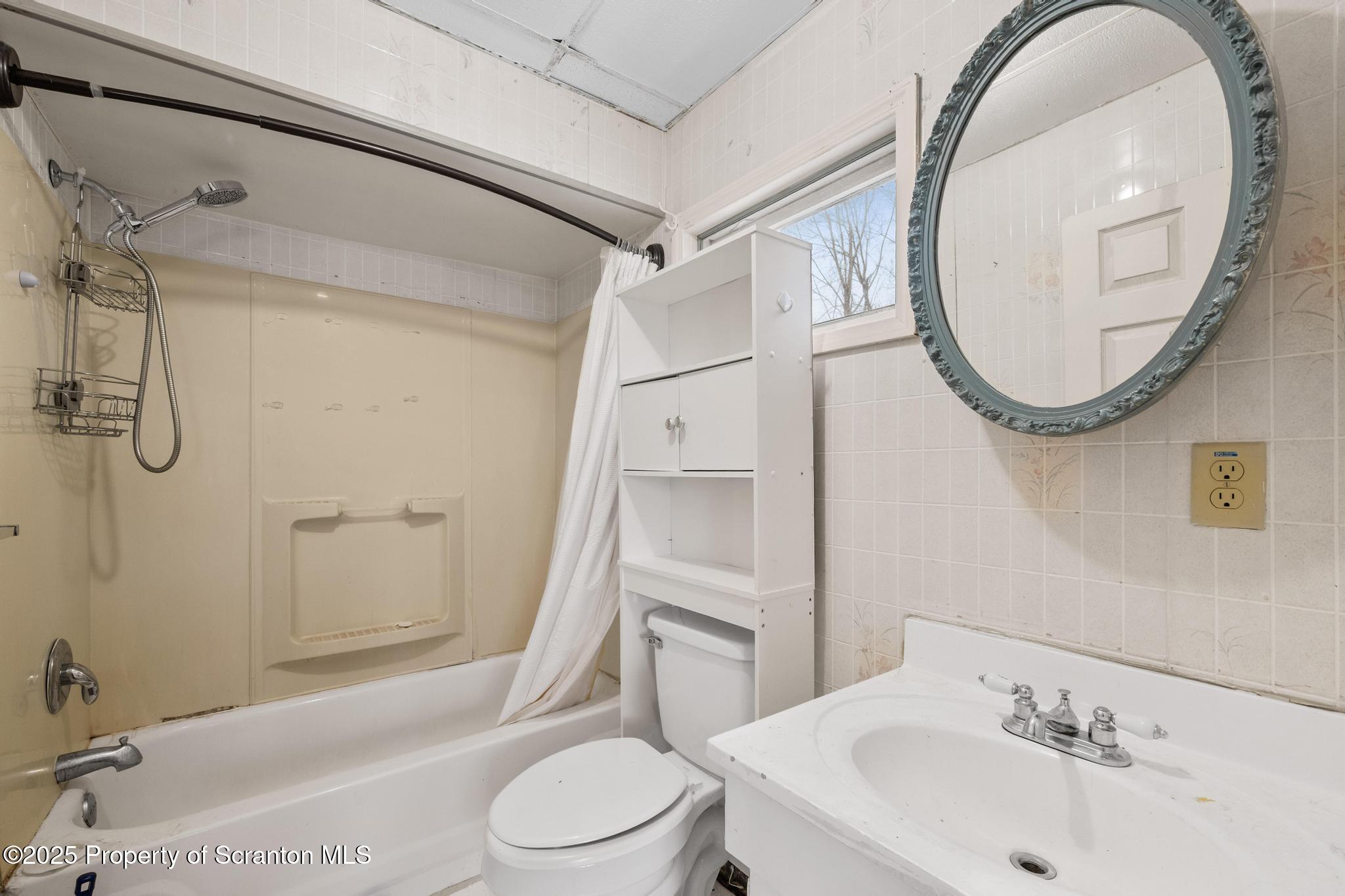 729 Moltke Avenue Scranton, PA 18505 - Photo 35 of 43 a bathroom with a toilet a sink and a mirror