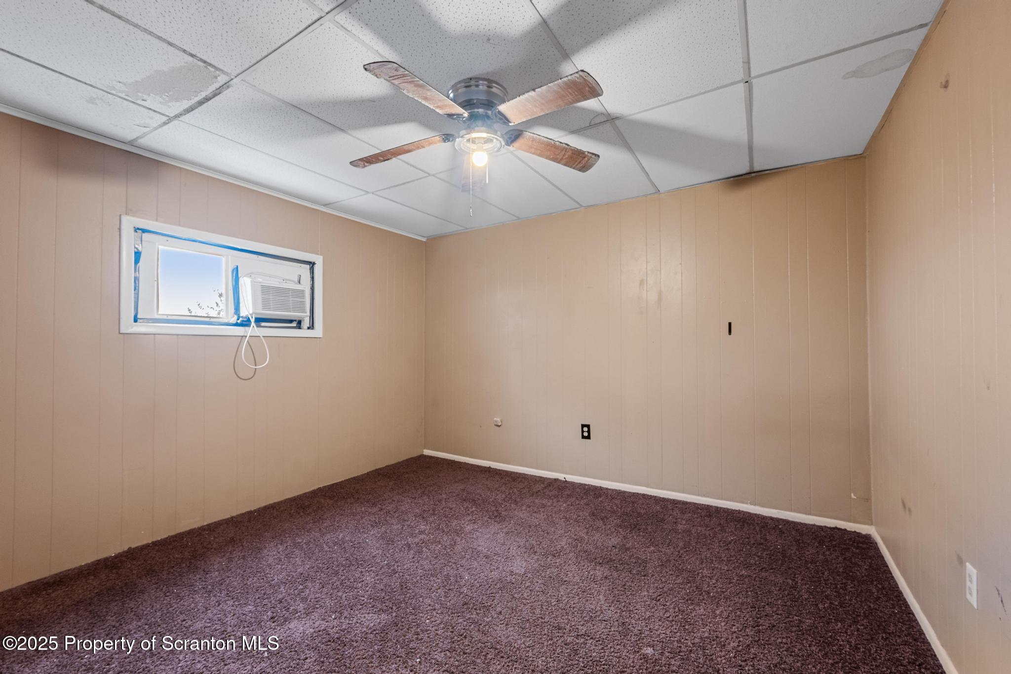 729 Moltke Avenue Scranton, PA 18505 - Photo 37 of 43 an empty room with a window and a fan