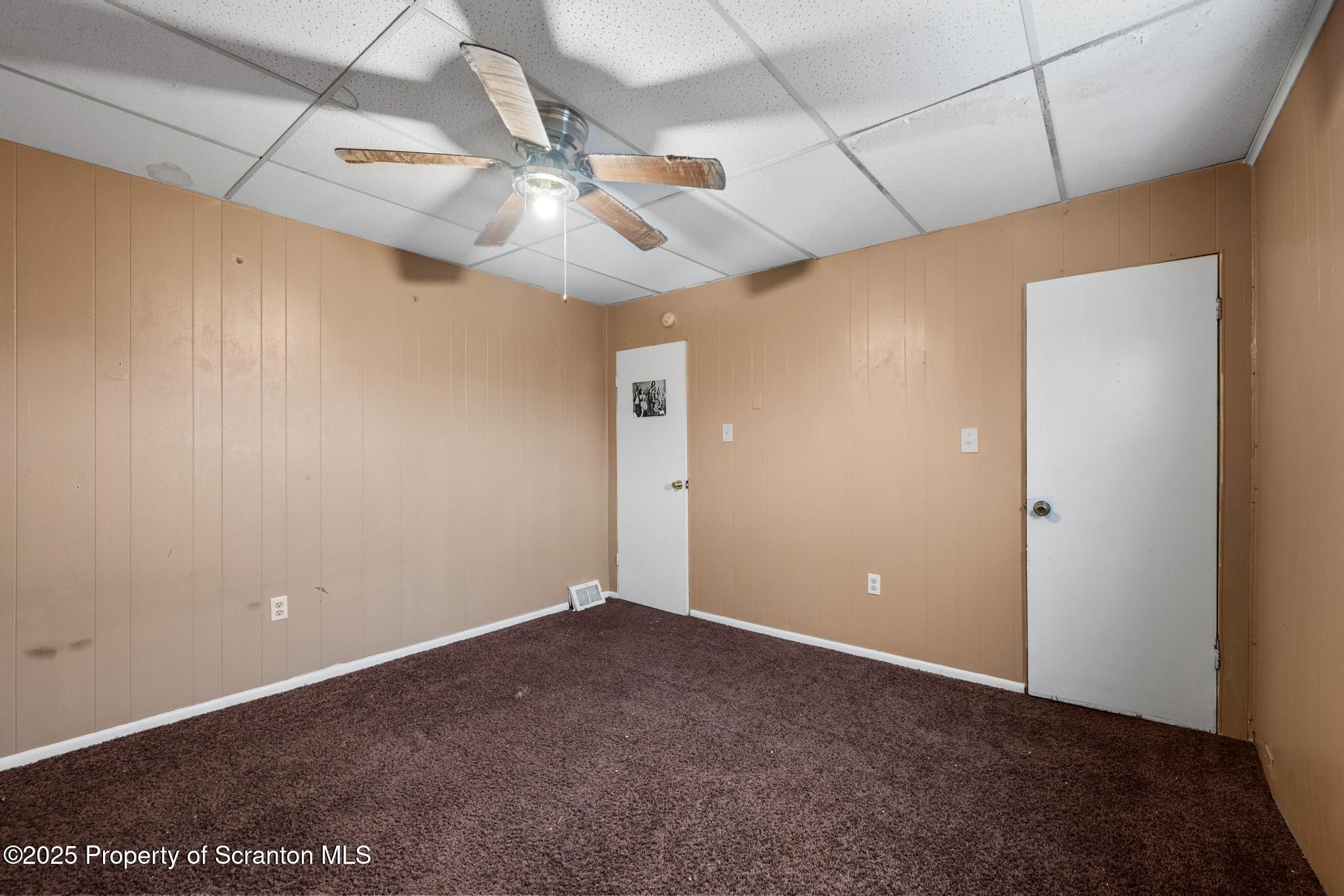 729 Moltke Avenue Scranton, PA 18505 - Photo 38 of 43 en empty room with ceiling fan and window