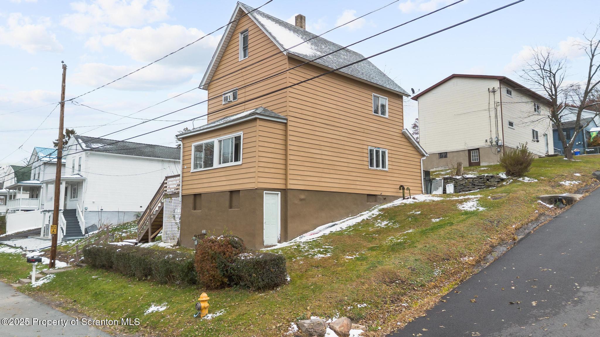 729 Moltke Avenue Scranton, PA 18505 - Photo 4 of 43 a view of a white house with a yard