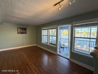 a view of a livingroom with furniture and wooden floor