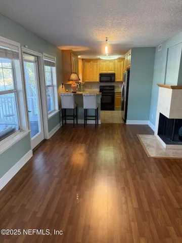 a view of a two chairs and table in the balcony