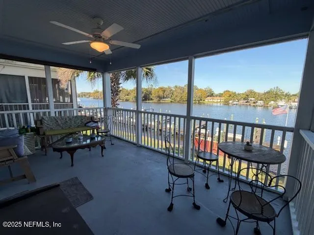 a view of a chairs and table in patio of the house