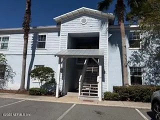 a view of a swimming pool with seating area
