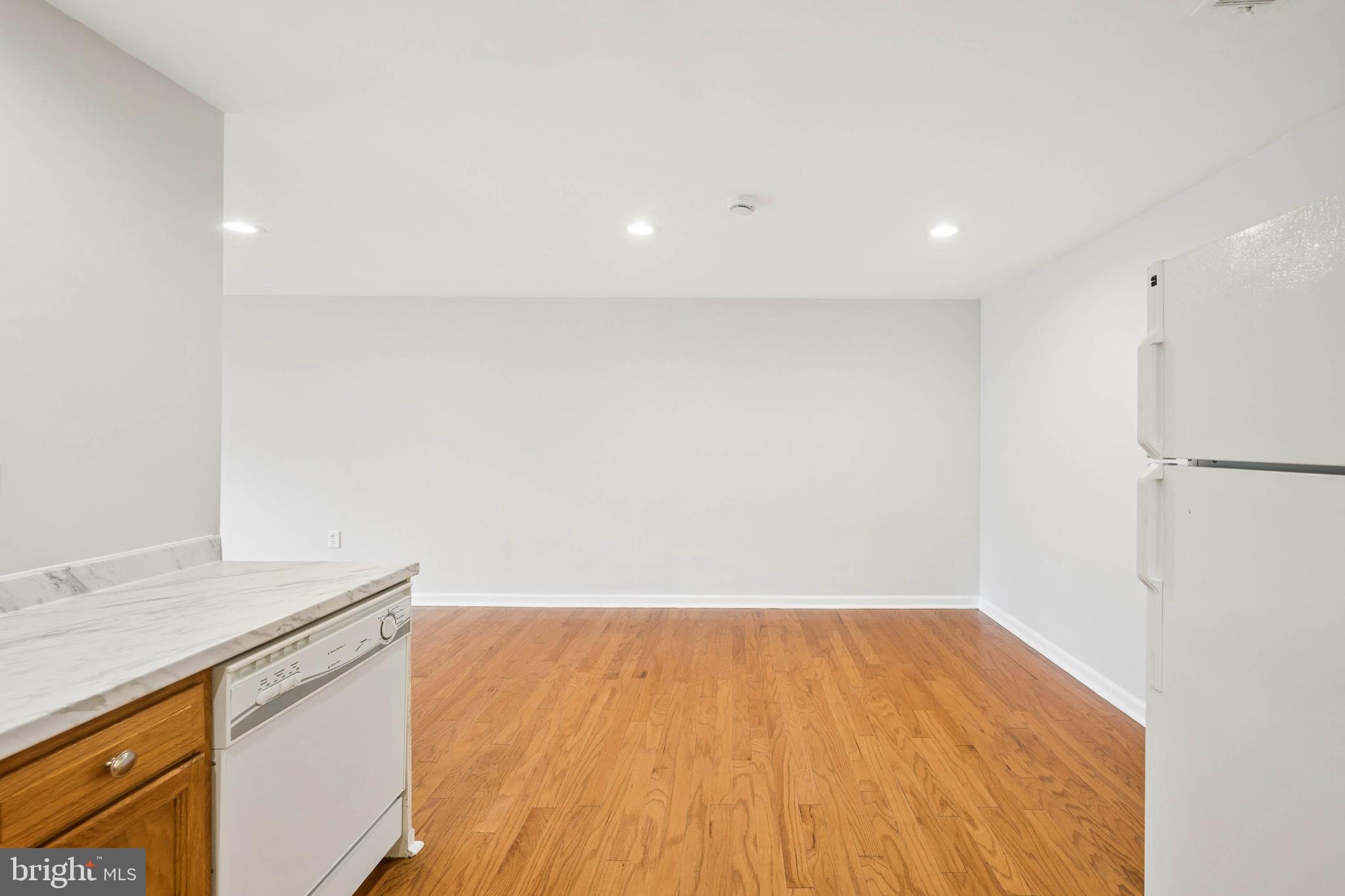 7227 Sindall Road Baltimore, MD 21234 - Photo 24 of 62 a view of storage and utility room with wooden floor