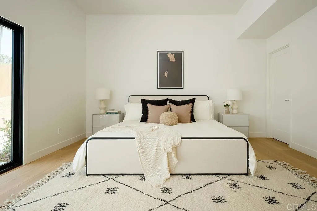 2025 Valley Road Oceanside, CA 92056 - Photo 13 of 31 a large bed sitting in a bedroom next to a window
