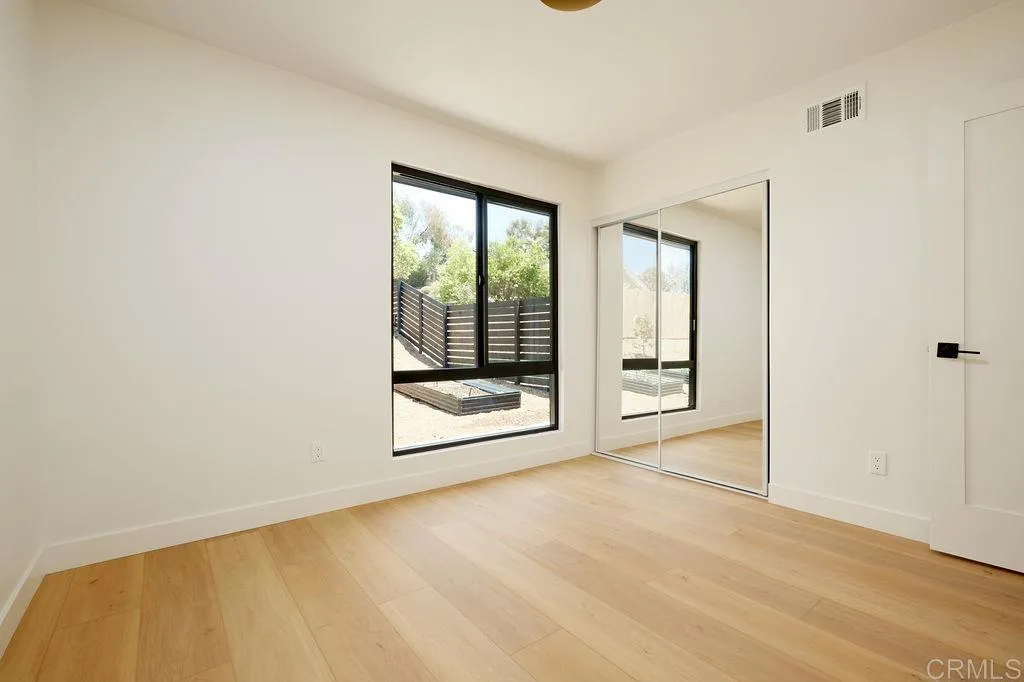 2025 Valley Road Oceanside, CA 92056 - Photo 18 of 31 a view of an empty room with glass door and windows
