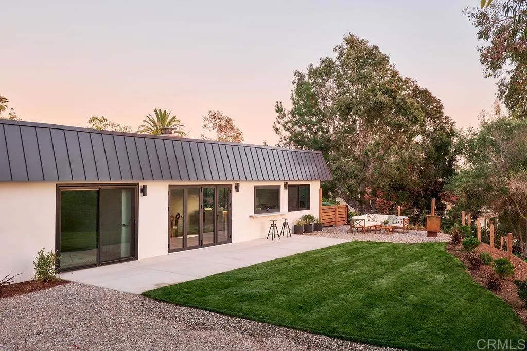2025 Valley Road Oceanside, CA 92056 - Photo 22 of 31 a front view of a house with a garden and trees