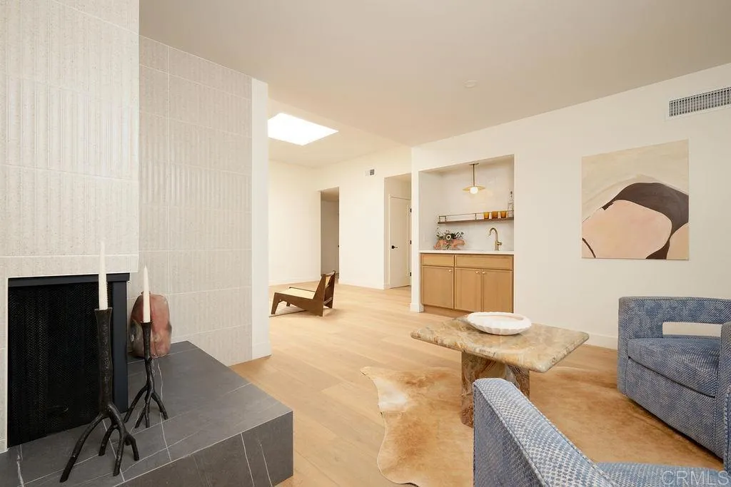 2025 Valley Road Oceanside, CA 92056 - Photo 5 of 31 a living room with furniture and a fireplace