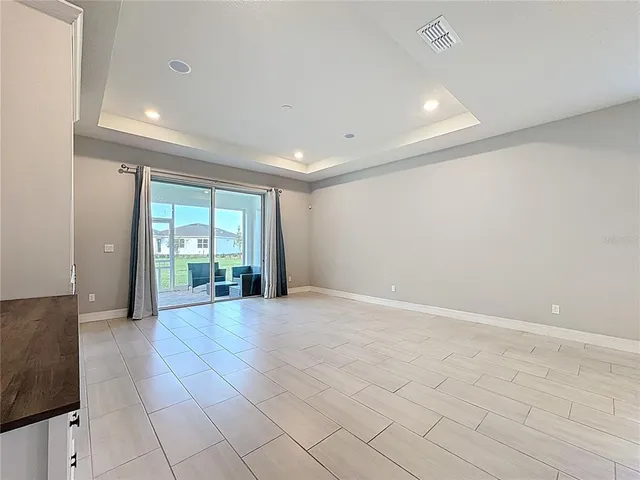 a view of a kitchen with furniture and a fireplace