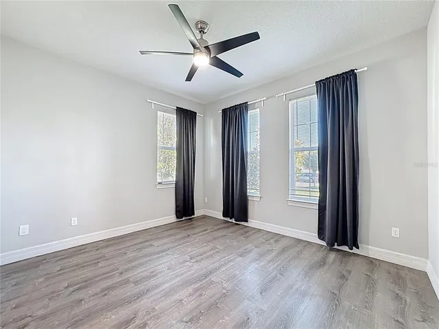 a bathroom with a sink a mirror a toilet and bathtub