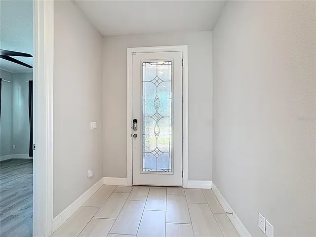 a view of an entryway with wooden floor