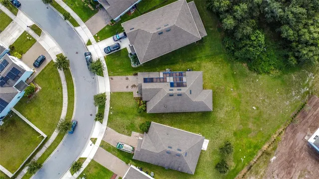 an aerial view of a pool patio swimming pool and outdoor seating