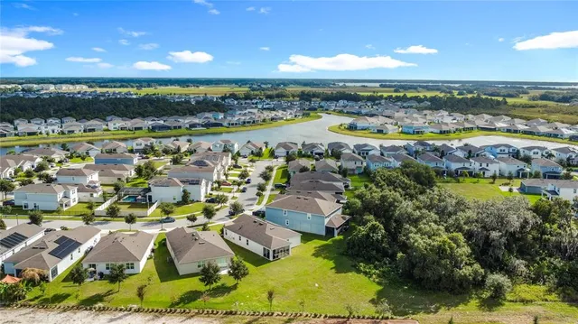 an aerial view of a house with outdoor space