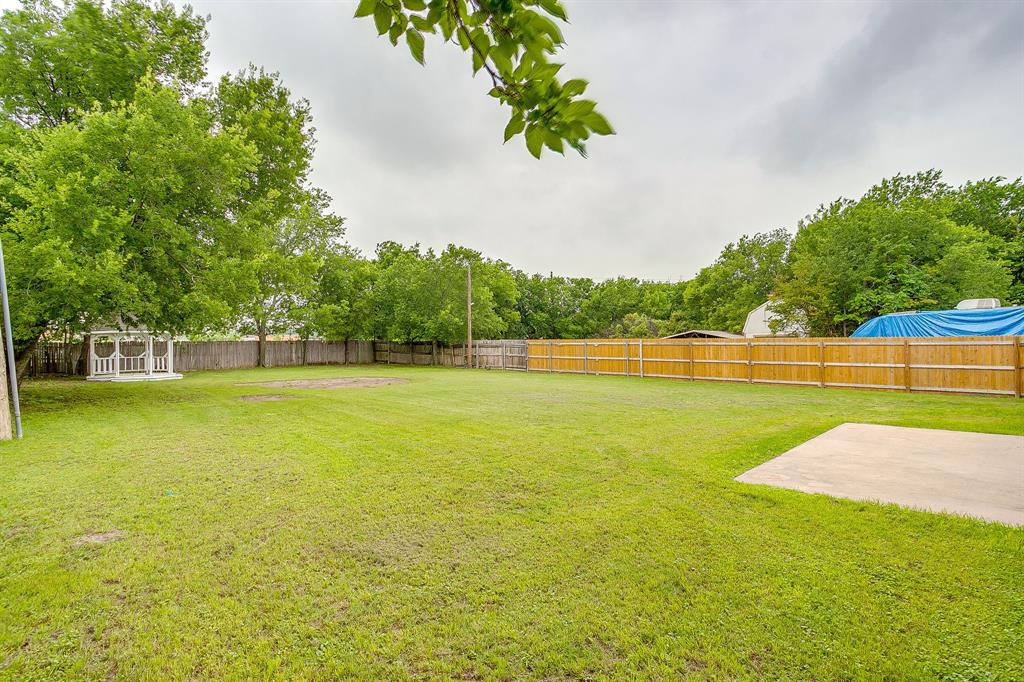8613 Silver Creek Road White Settlement, TX 76108 - Photo 31 of 40 a view of yard with swimming pool and green space
