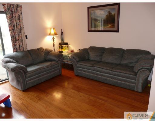 118 Redbud Road Piscataway, NJ 08854 - Photo 4 of 6 a living room with furniture and a lamp