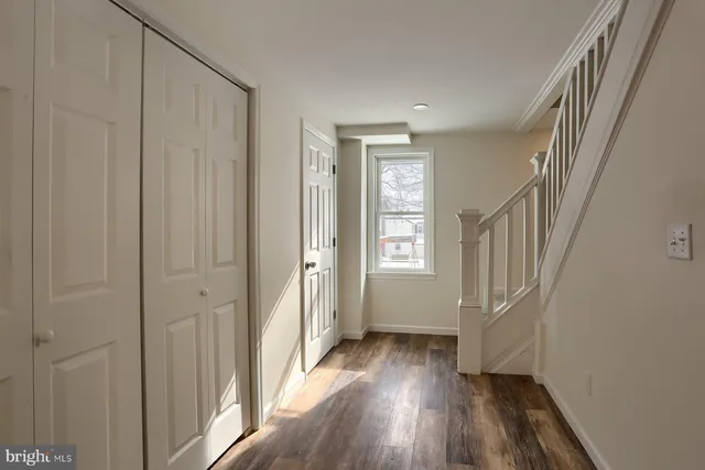 a view of an empty room with a fan