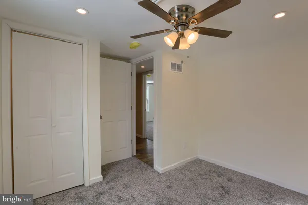 wooden floor in a hall with a window