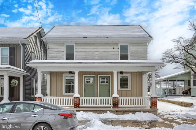 a kitchen with stainless steel appliances a refrigerator sink and microwave