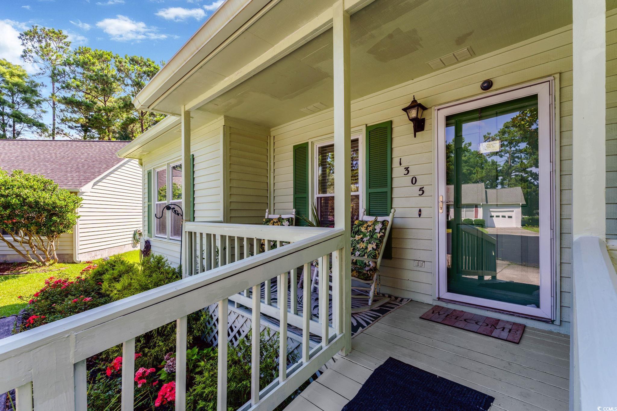 1305 Conifer Court Murrells Inlet, SC 29576 - Photo 16 of 30 View of front of home with covered porch and a fro