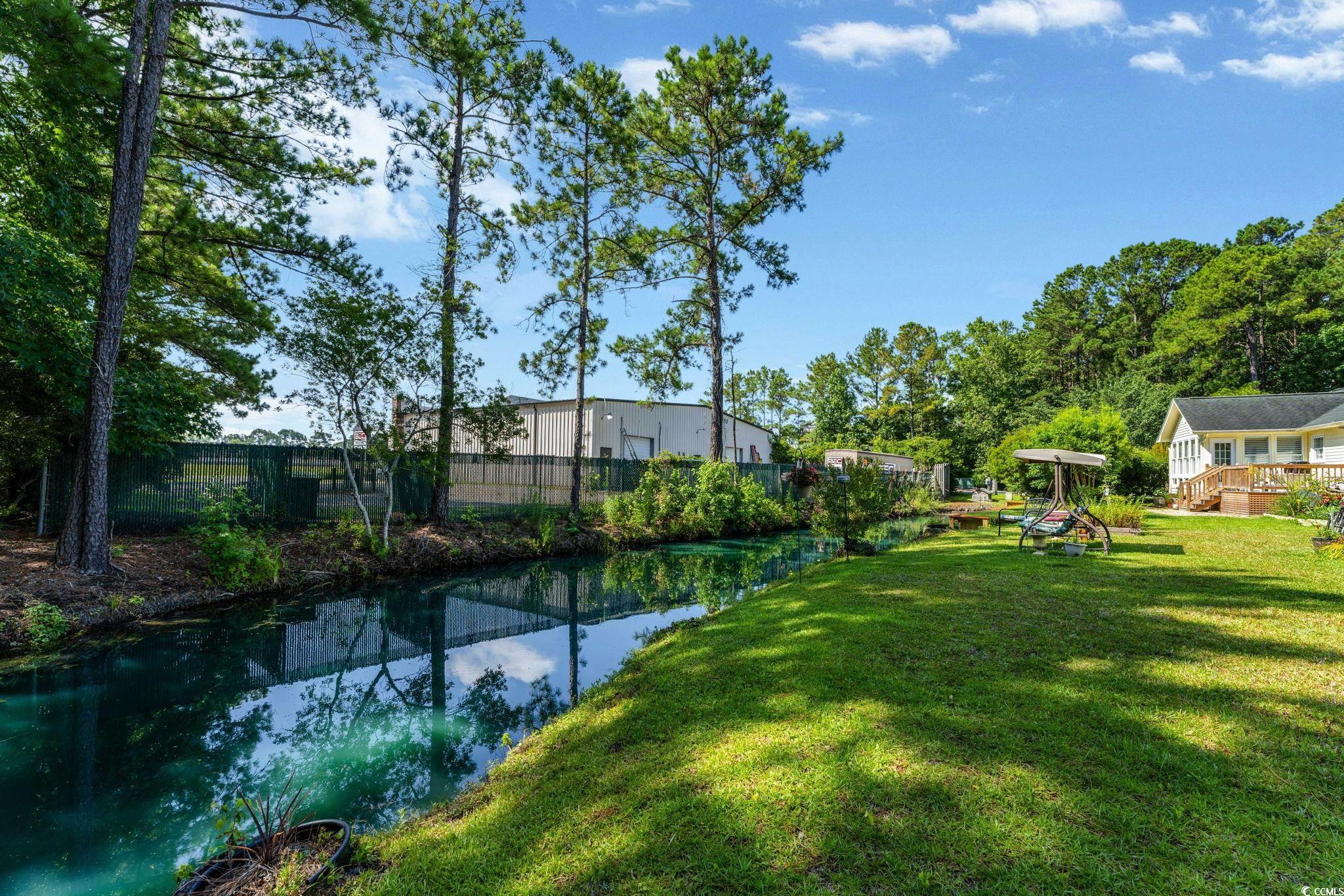 1305 Conifer Court Murrells Inlet, SC 29576 - Photo 25 of 30 View of yard with a wooden deck